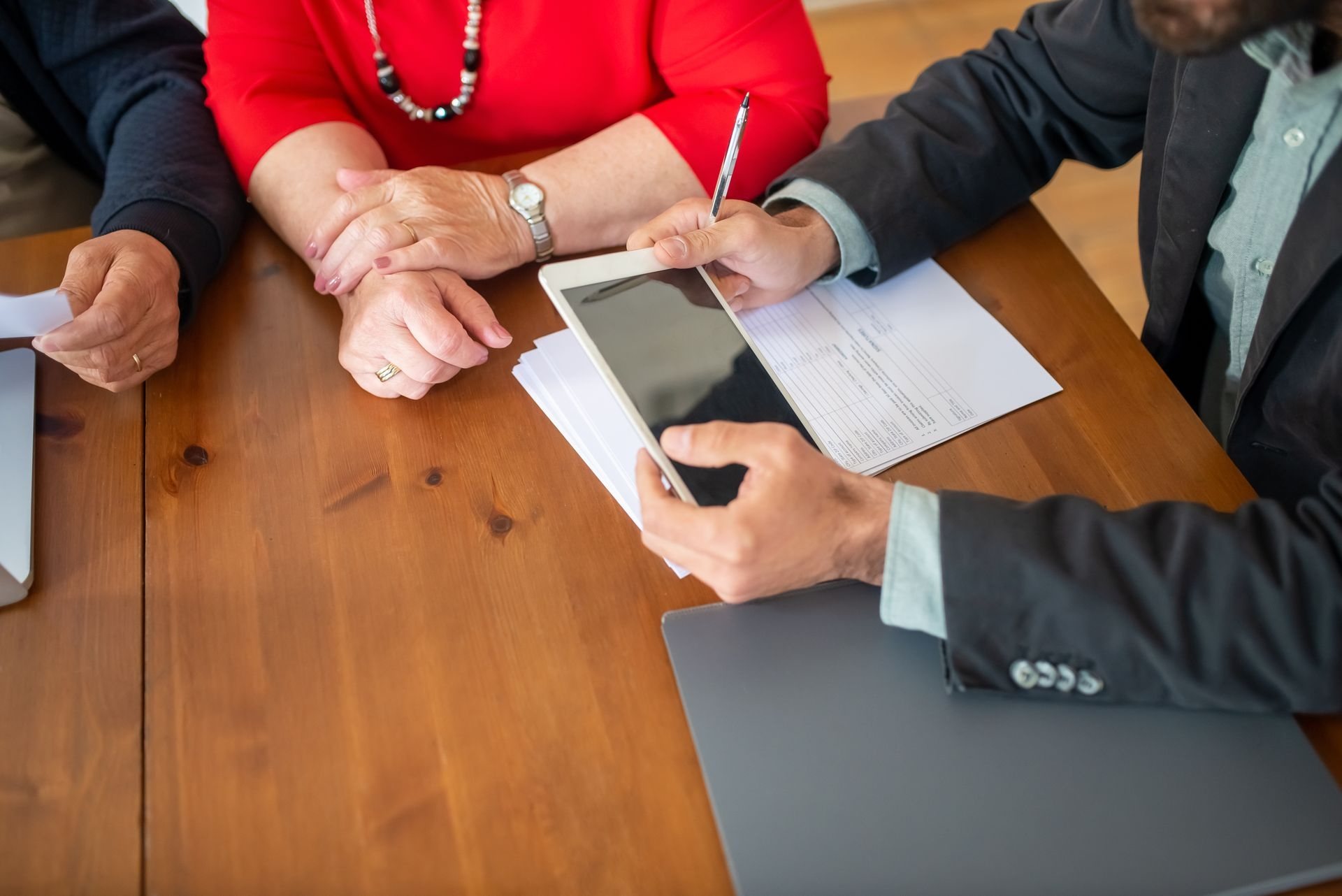 Client and attorney discussing support paperwork at a conference table