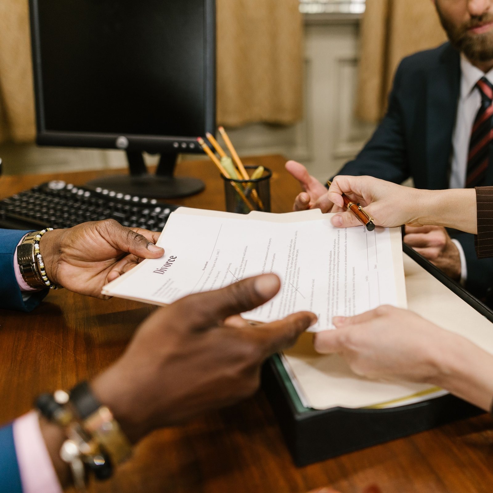 Agreement being handed across a mediation table