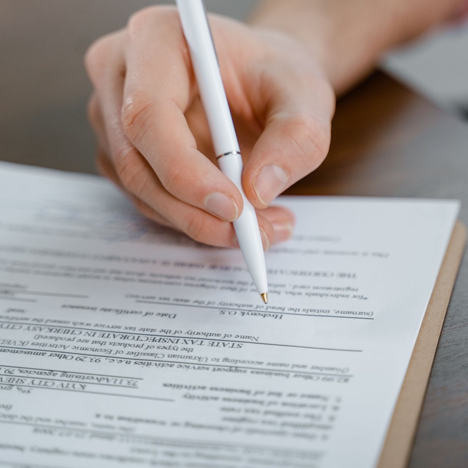 Vehicle title and ownership paperwork spread across a desk