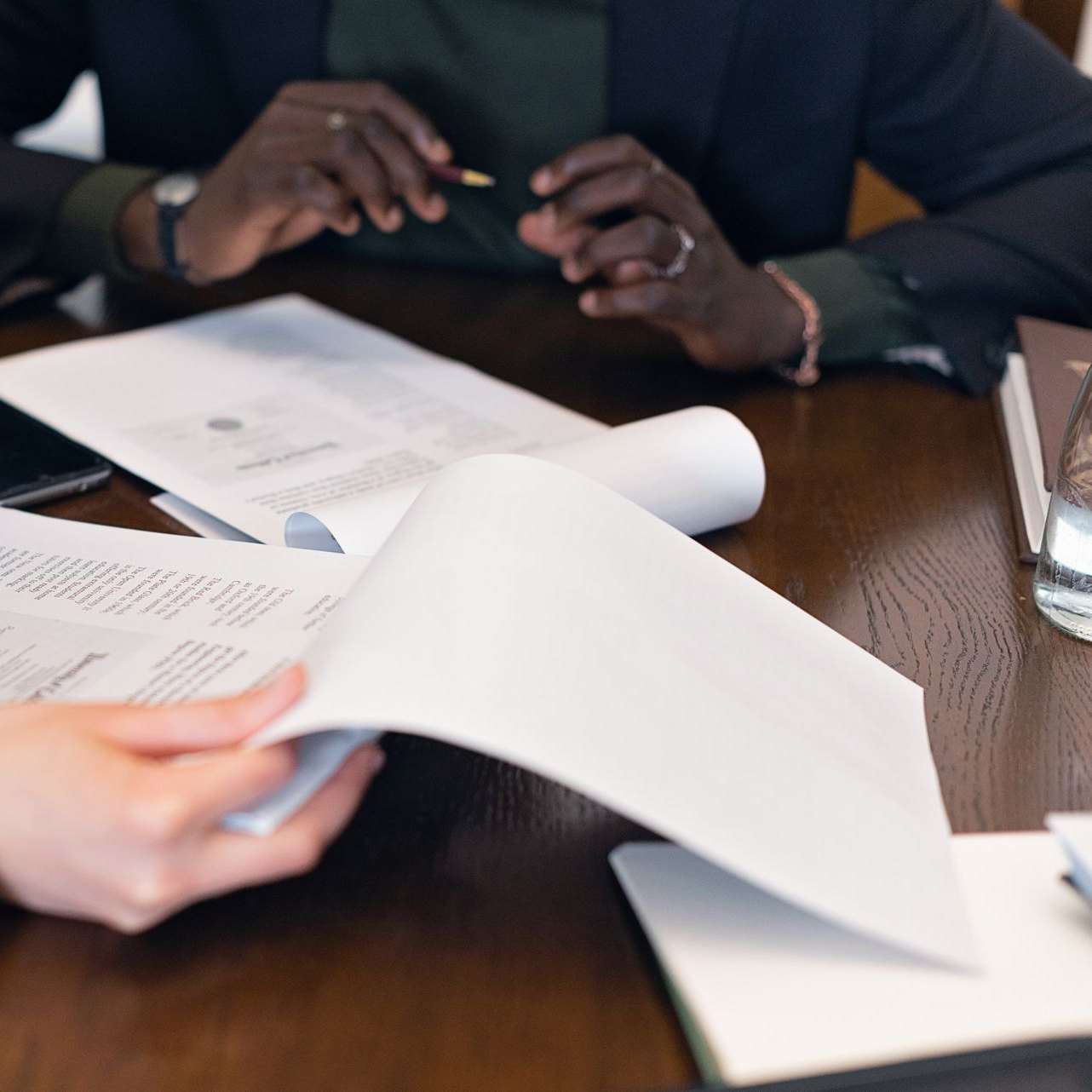 Client and attorney comparing two property files side by side