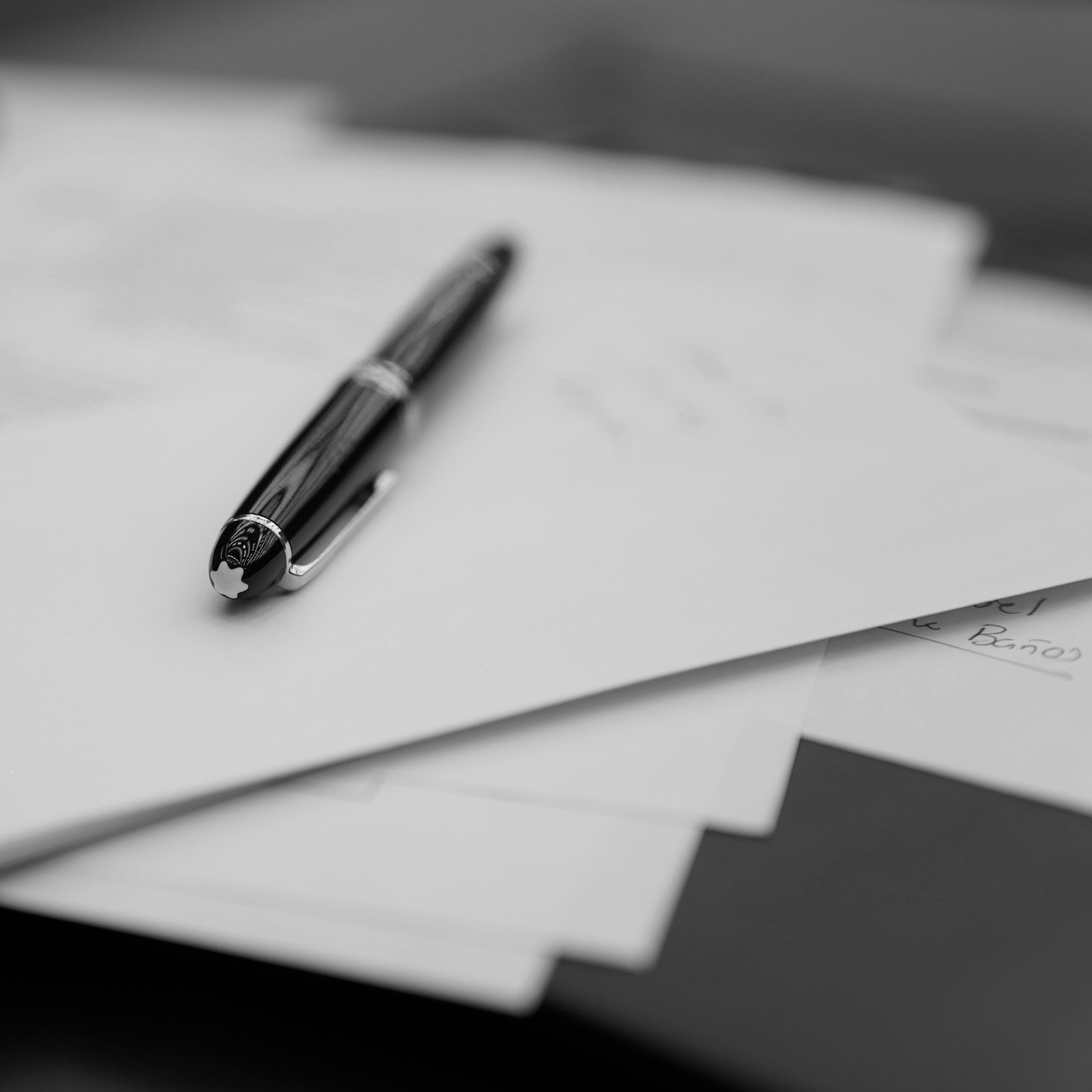 Financial support paperwork with a pen resting across the page