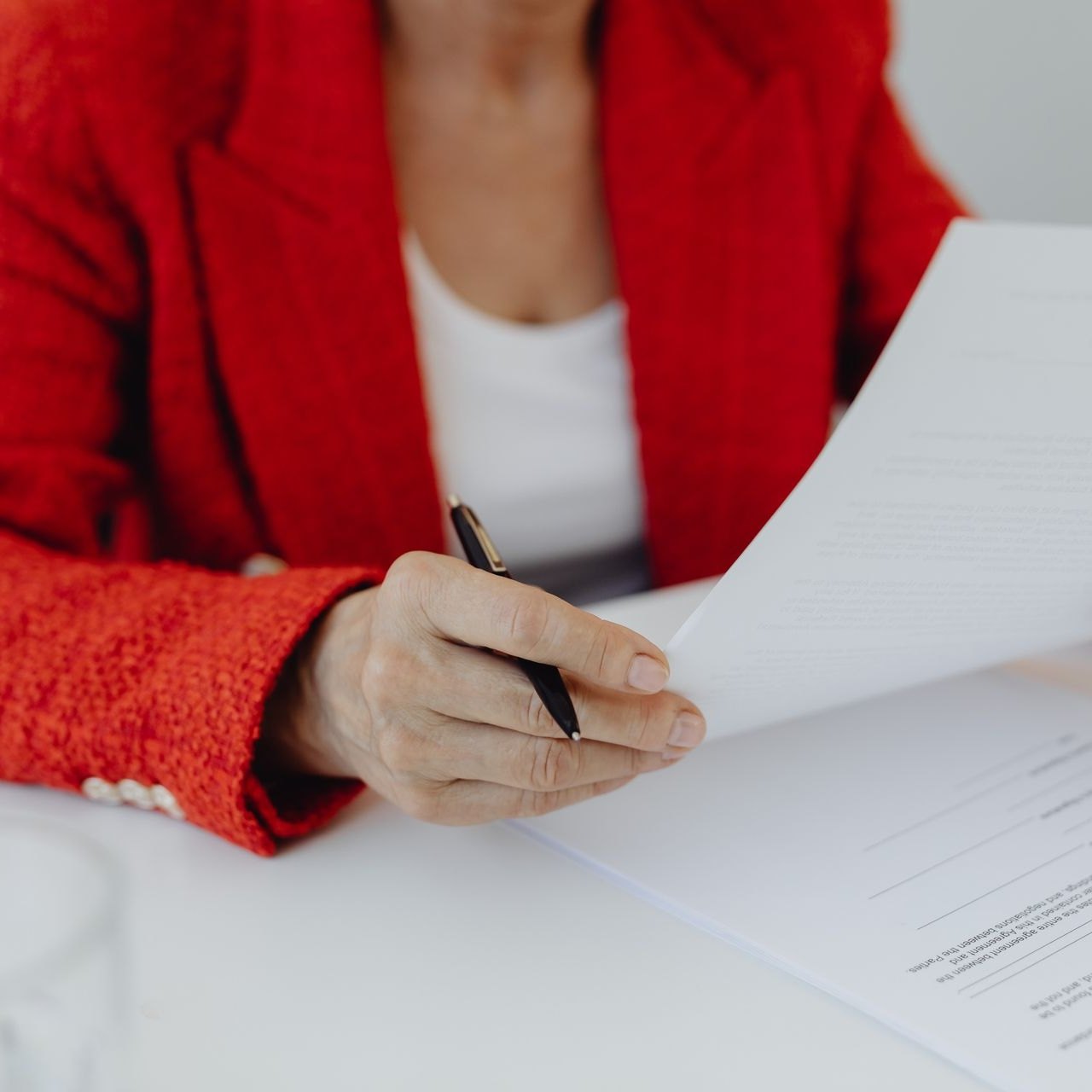 Financial statements and a pen laid out for review